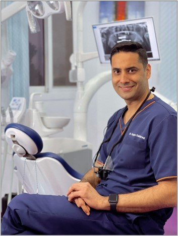 Dr. Gagan Sabharwal seated in a dental clinic